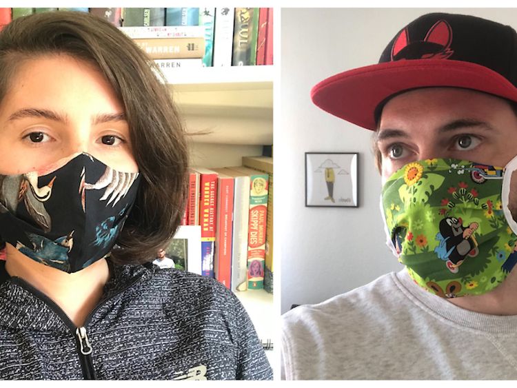  Woman and man wearing face masks