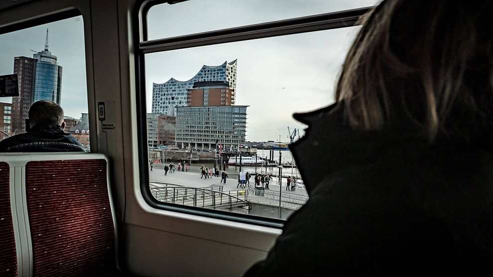 View of the Elbphilharmonie concert building from the window of a Hochbahn U-Bahn train car