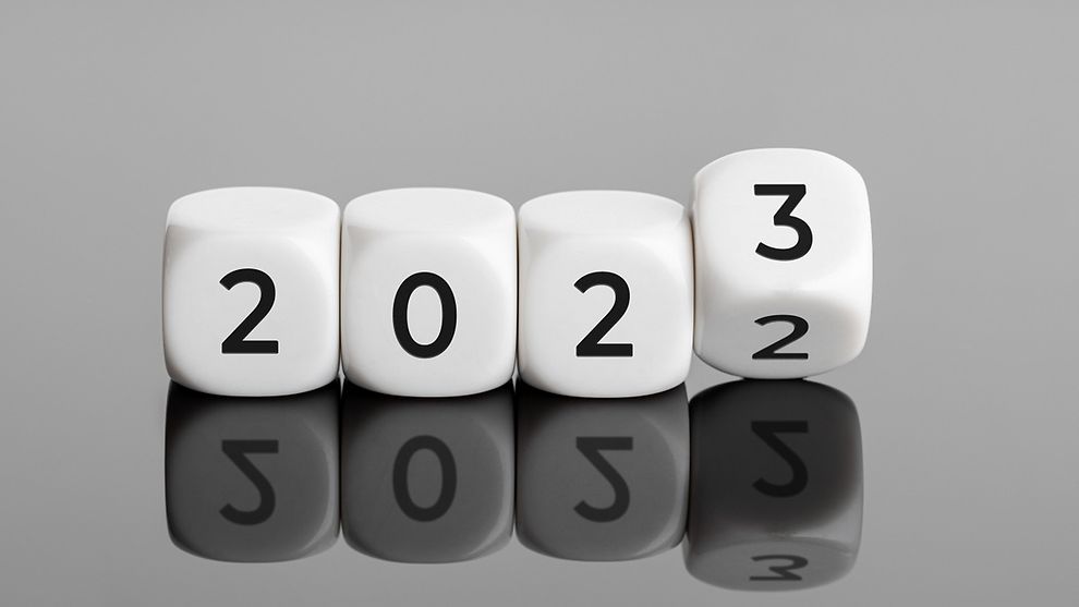 Set of four dice spelling out 2023, with the last dice flipping from 2 to 3