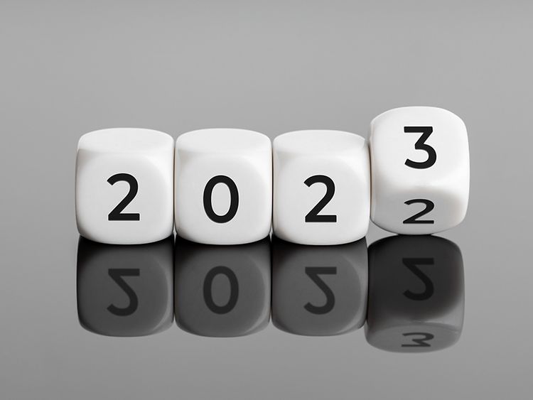  Set of four dice spelling out 2023, with the last dice flipping from 2 to 3