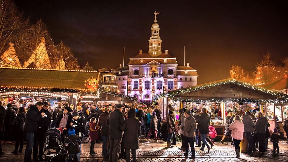 A Christmas market full of people against a festive background