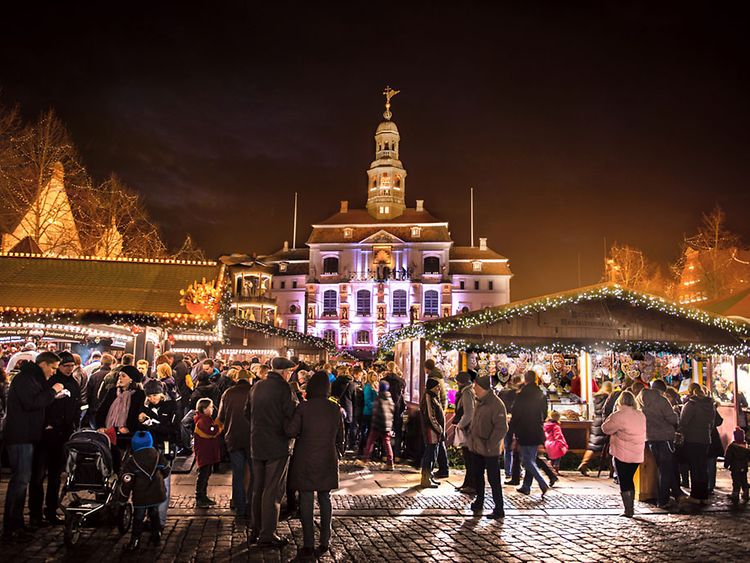  A Christmas market full of people against a festive background